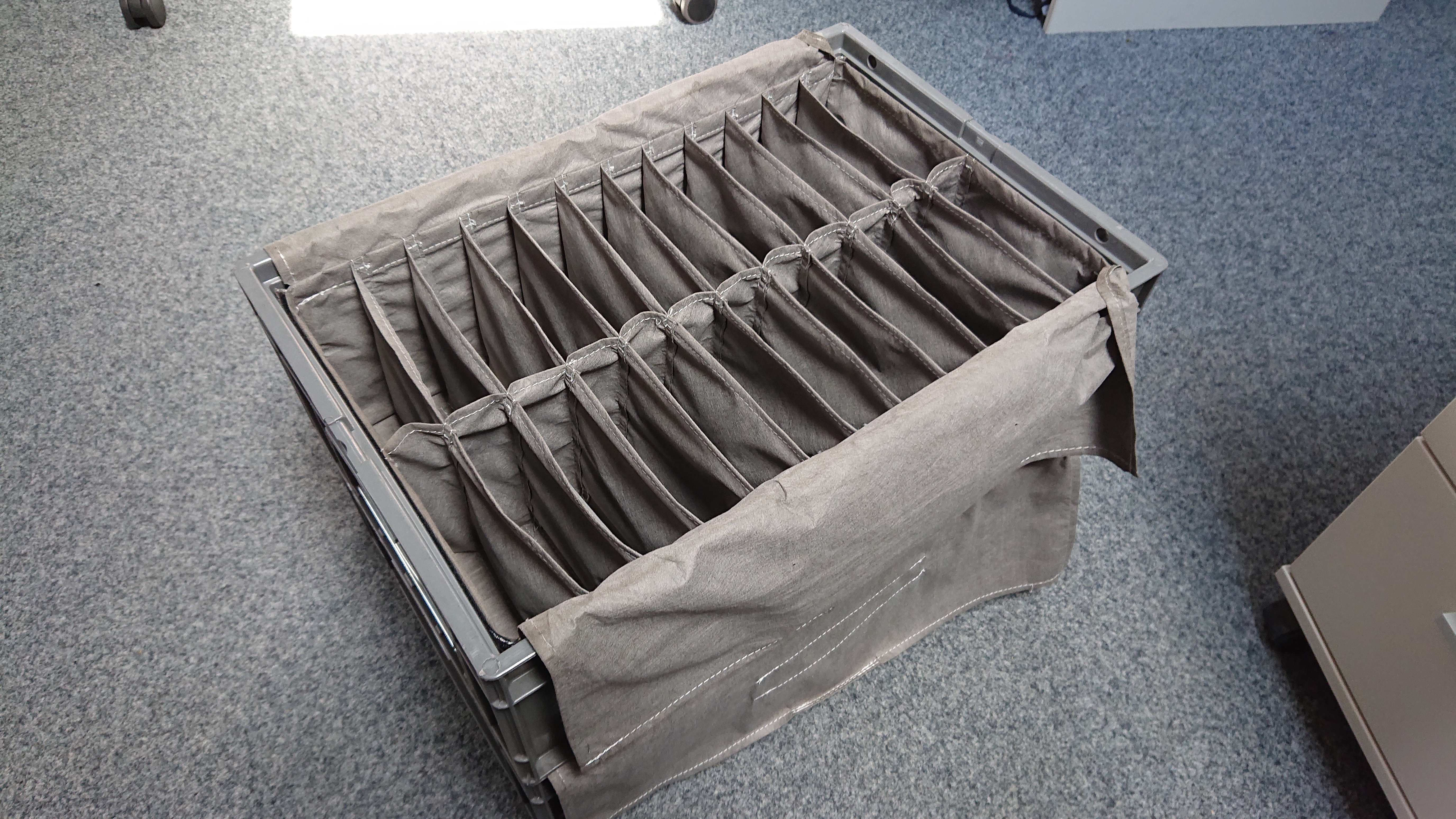 Textile inserts with multiple compartments for organizing small parts