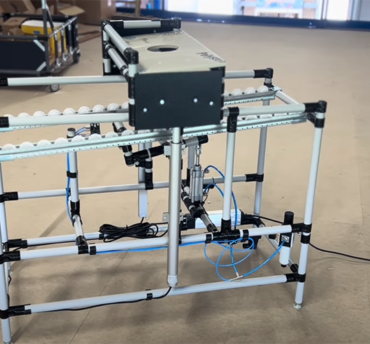 Conveyor for laser station with height-adjustable platform